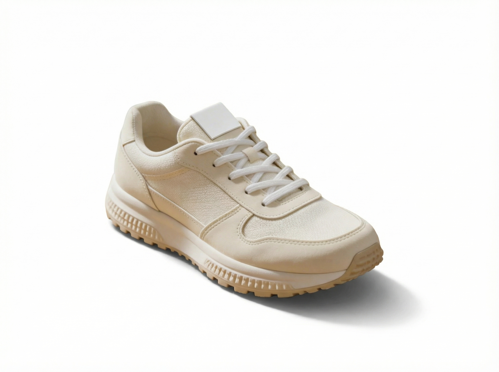 The same off-white running shoe centered on a seamless white studio background with a soft shadow for a catalog-style product photo.